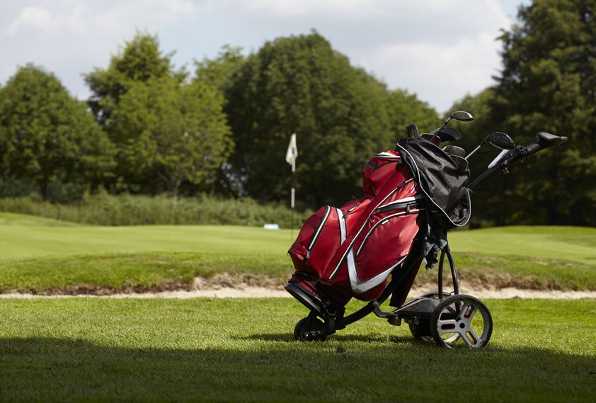 an electric golf trolley on a golf course