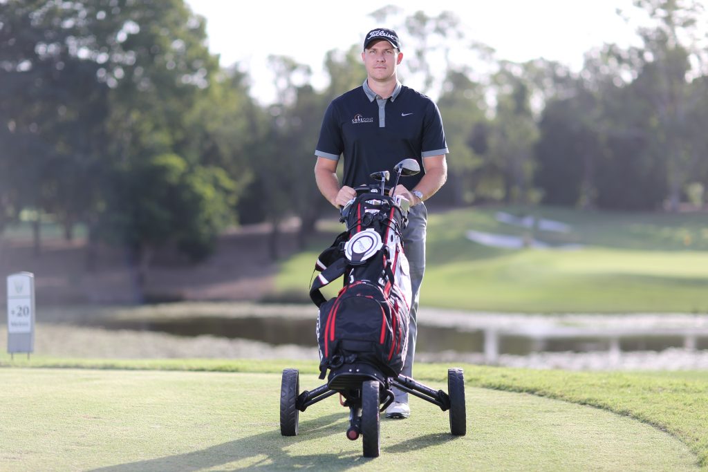  golfer with his electric golf trolley